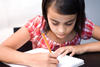 Young girl writing
