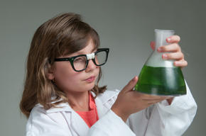 Girl holding flask in science laboratory