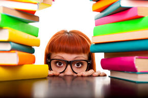 Young girl surrounded by books