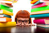 Young girl surrounded by books