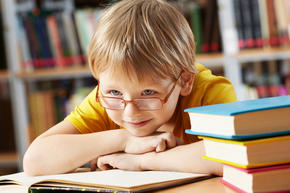Boy reading in the library