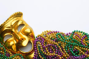 Gold mask and mardi gras beads