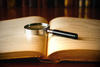 book with magnifying glass