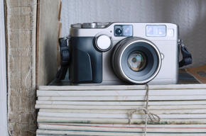 antique camera on top of books