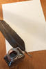 paper with ink and a quill