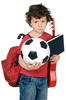 Little boy holding a book, soccer ball, and guitar