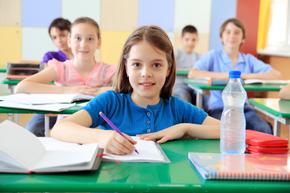 students writing at their desks