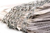 newspaper wrapped in chains